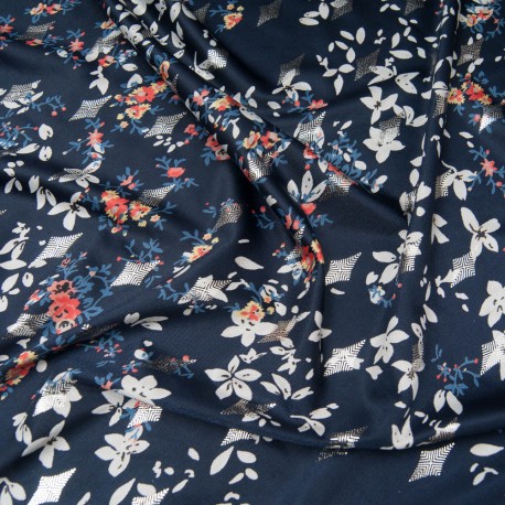 Au mètre maille polyester et Lycra bleu marine, motif losange argenté sur petit bouquet fleuri beige et orange n°10201