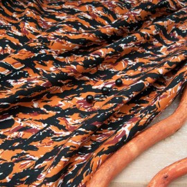 Tissu twill viscose fond orange vague noire en 145cm n°11000