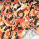 Coupon maille polyester élasthanne fond safran à motifs  2m90 en 145cm n°11025