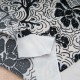 Coupon maille polyester élasthanne fond safran à motifs  2m40 en 150cm n°11043